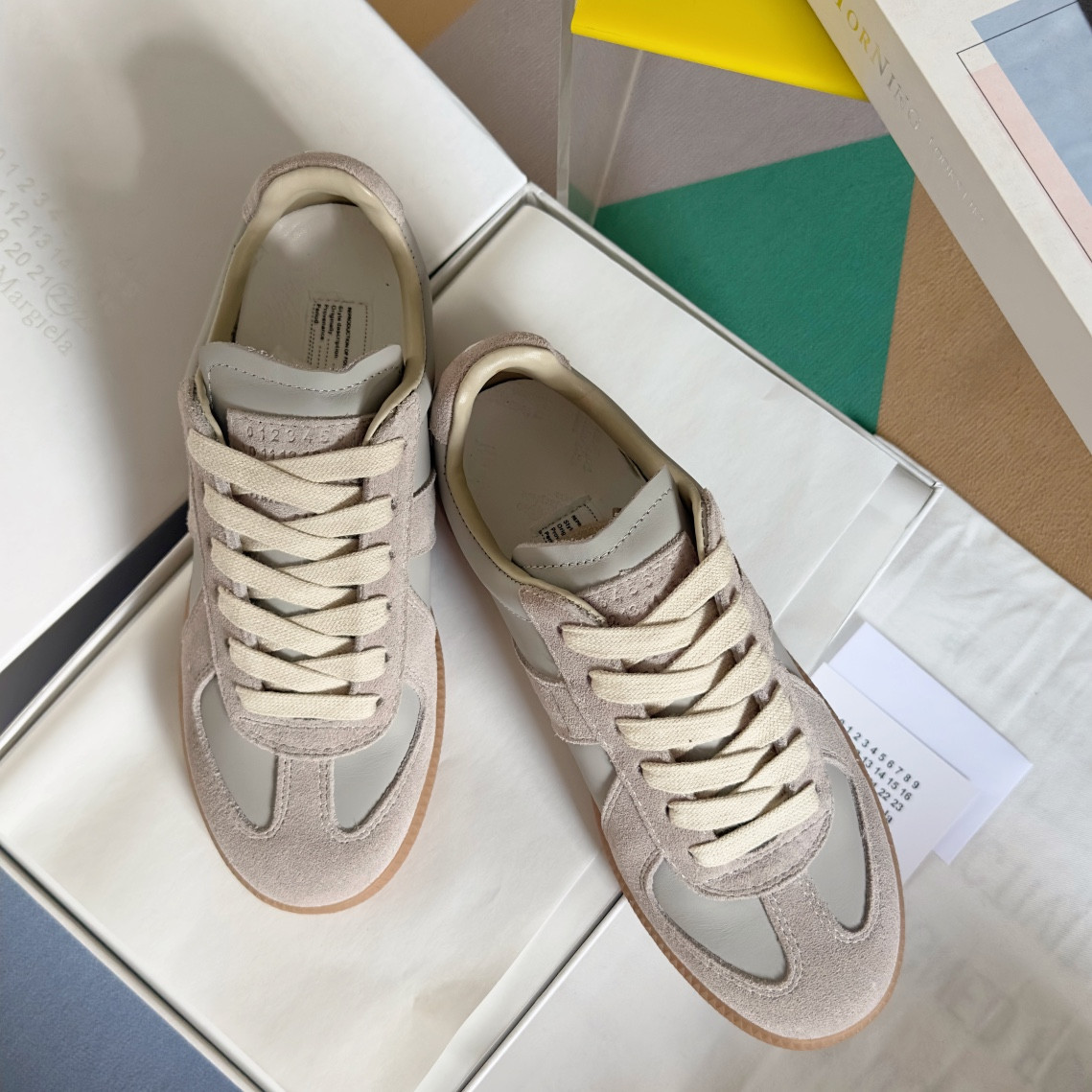 ua ma*s*n Ma*i*la mm6 sneakers