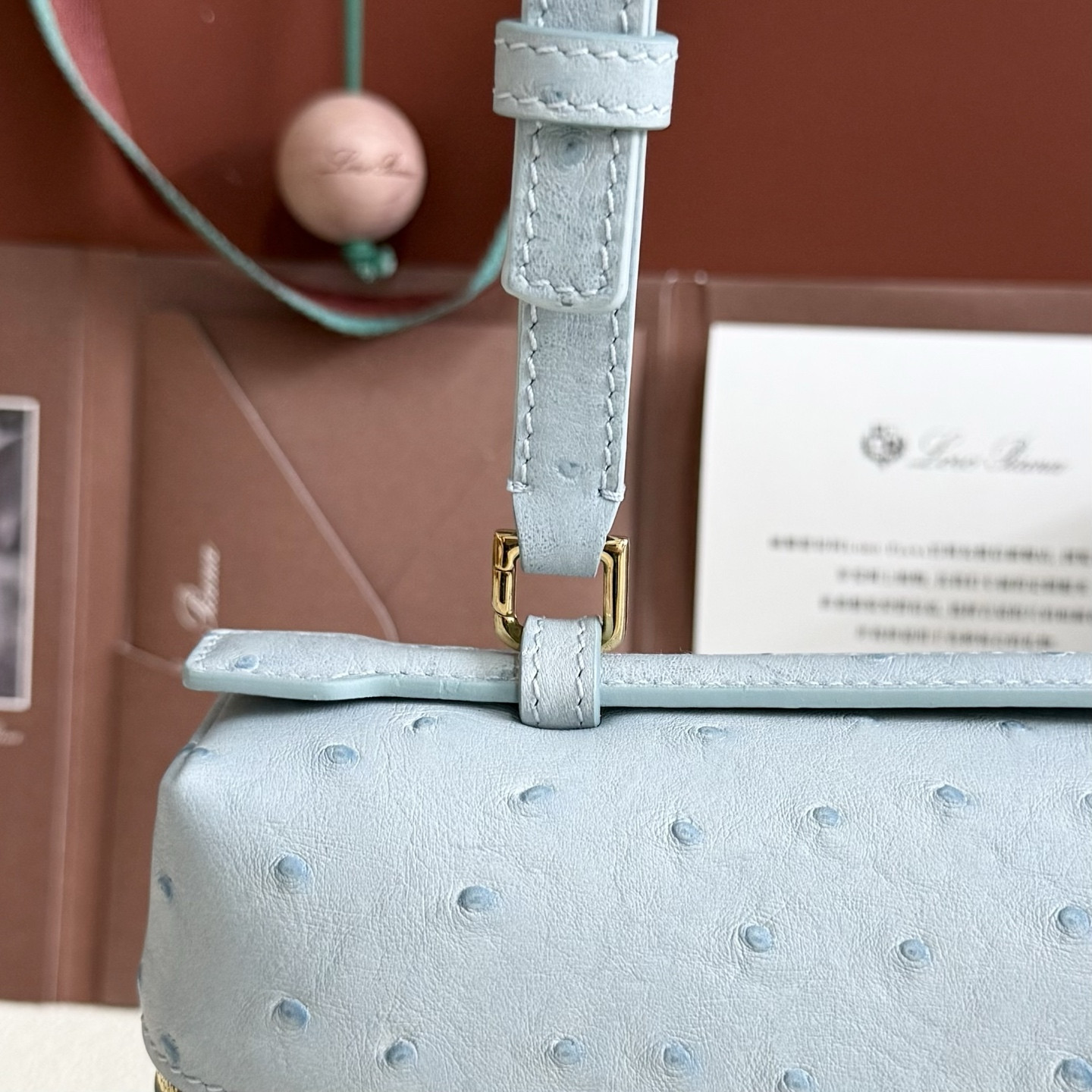 L**o p*ana extra pocket l27 ostrich-grained leather 16x27x10cm