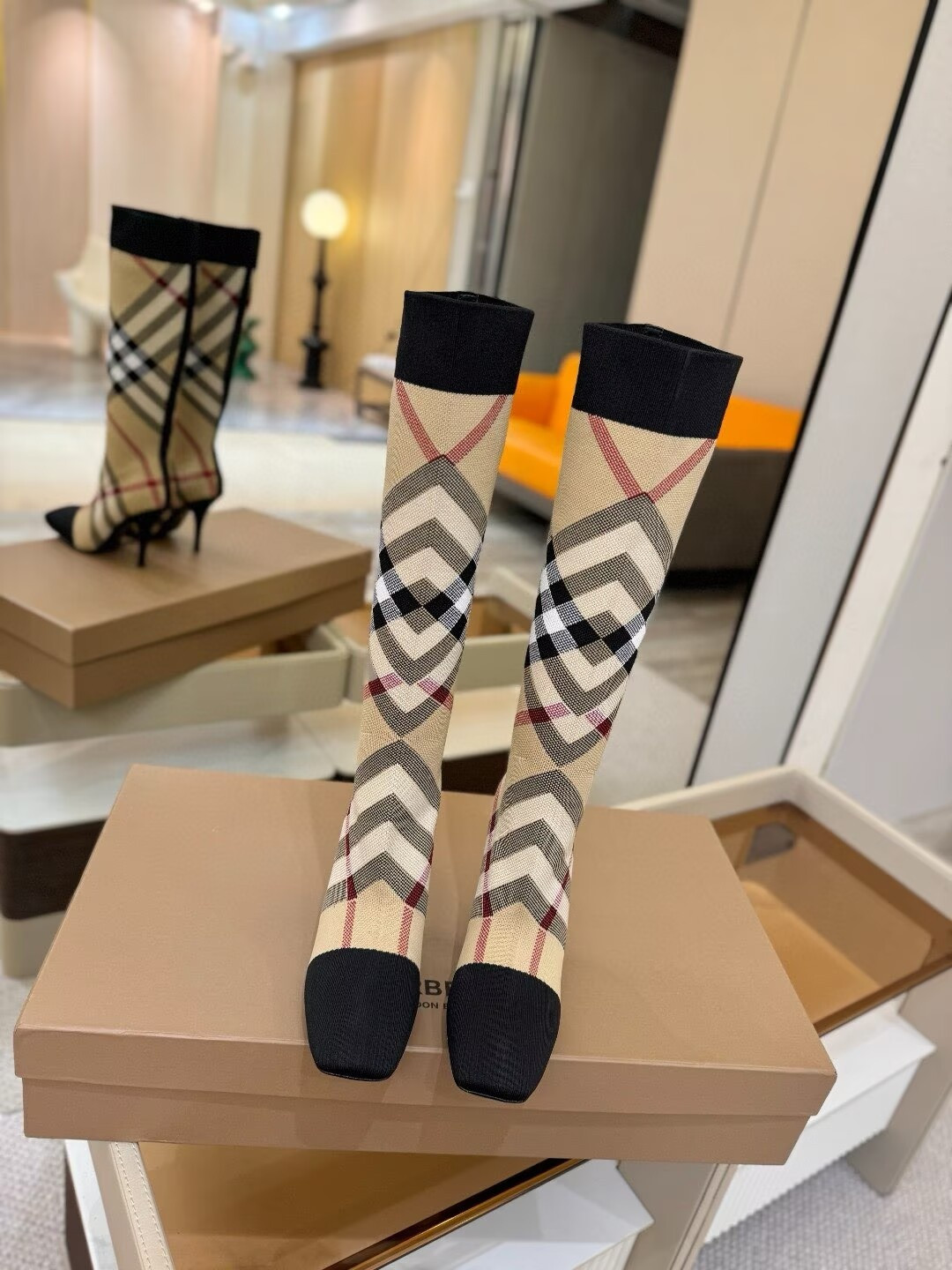 ua Bv*b*rry check high boots