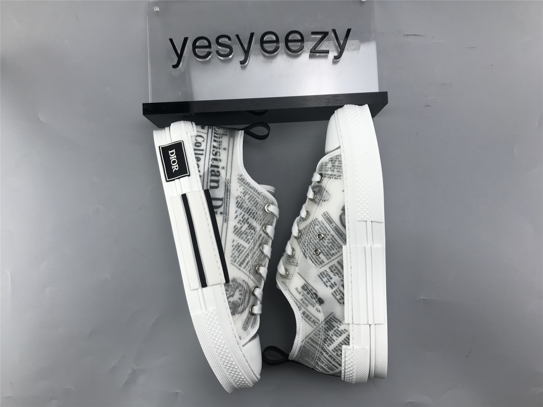 ua D10r b23 low top daniel asham newspaper