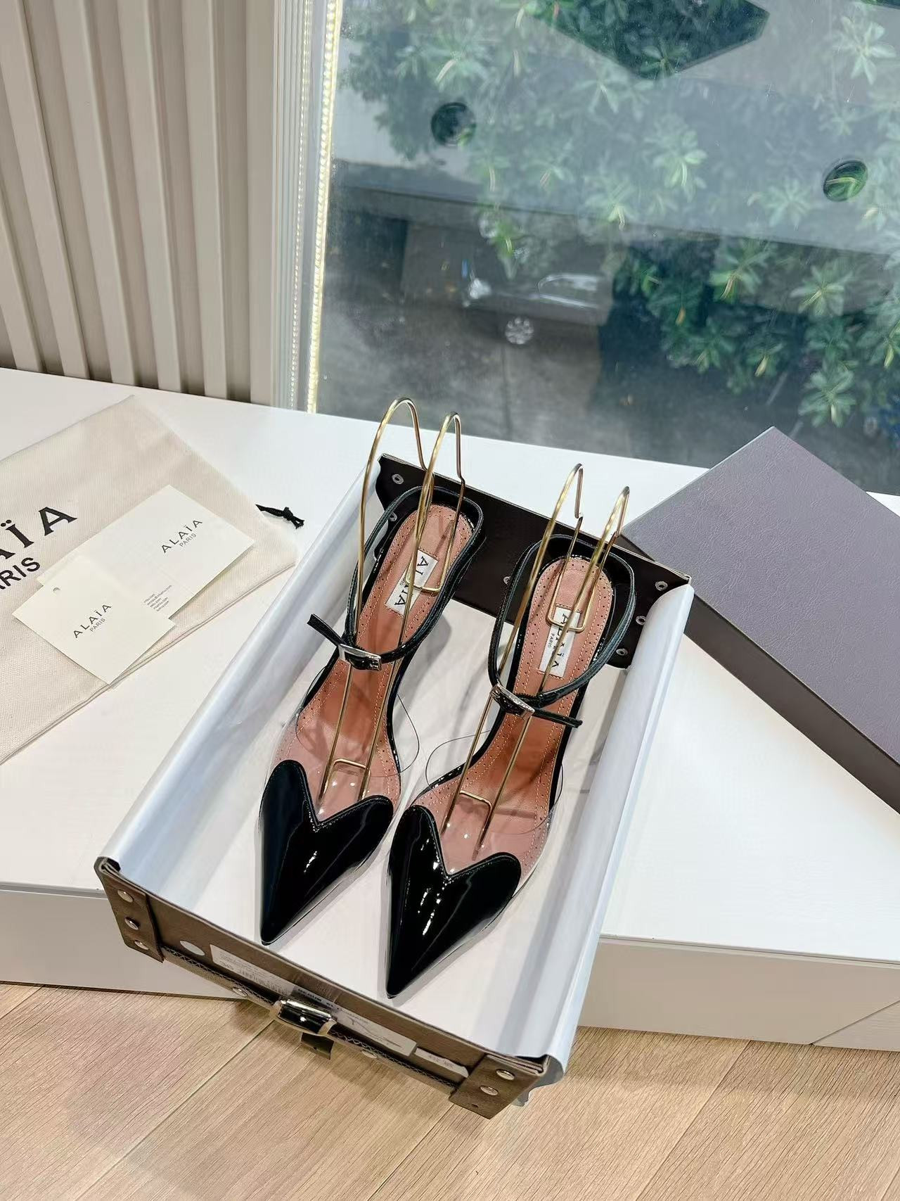 UA ALAÏA Patent Heart-Toe Stiletto Pumps