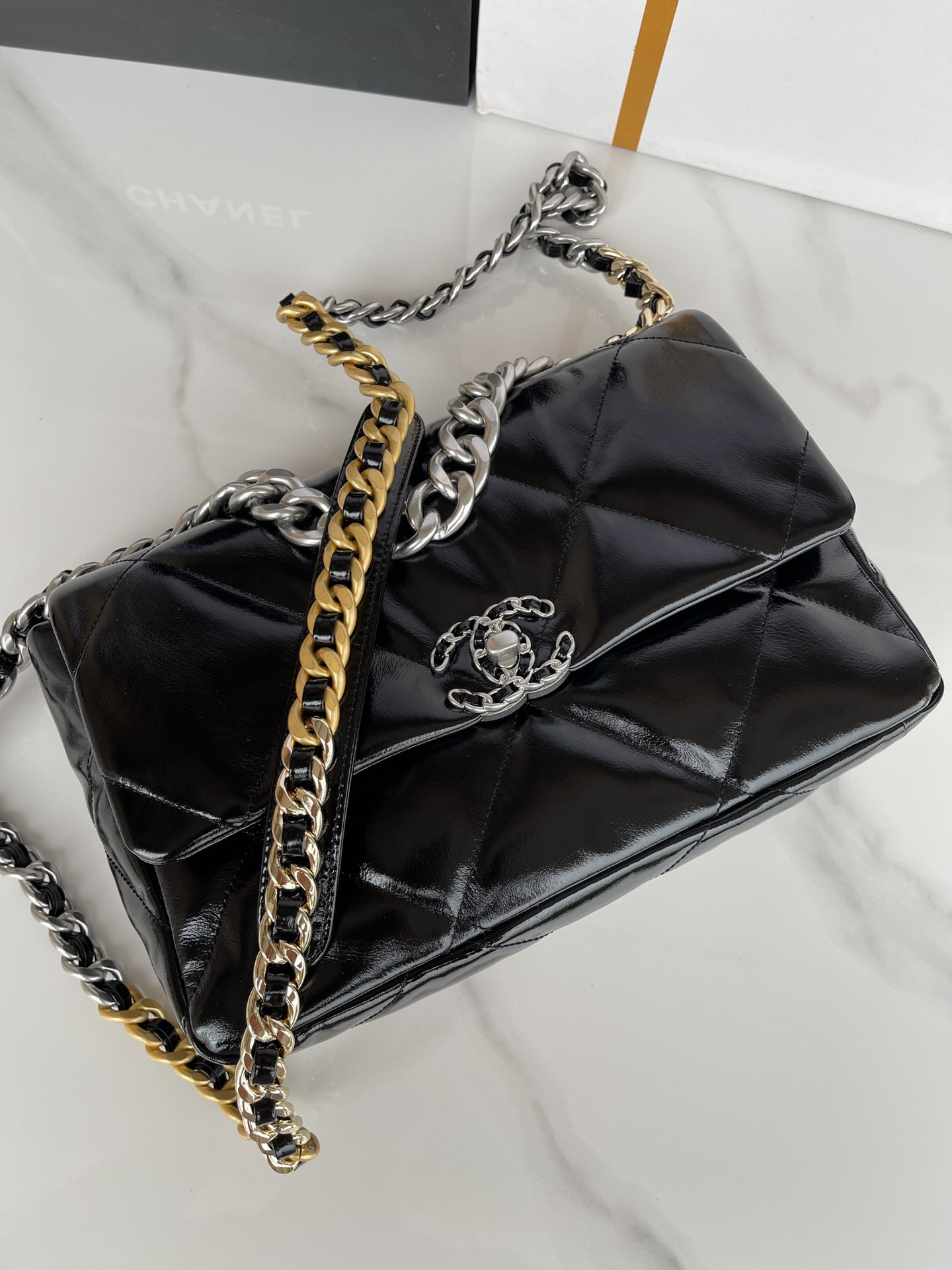 Ch**el 19 LARGE HANDBAG Shiny Leather, Gold-Tone, Silver-Tone & Ruthenium-Finish Metal Black 7.8 × 11.7 × 3.9 in